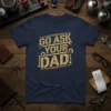 Navy t-shirt with "GO ASK YOUR DAD!" in distressed gold text, featuring wrench and gear graphics