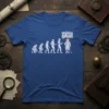 Evolution of man to golfer design with "Go Back We Screwed Up" text bubble, white line art on blue t-shirt
