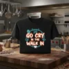 Black t-shirt with "Go Cry In The Walk In" in neon orange and blue text, surrounded by kitchen knives and
