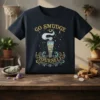 Go Smudge Yourself quote with sage smudge stick graphic on a dark t-shirt, featuring stars and decorative swirls