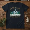 Go tell it on the MOUNTAIN that Jesus Christ is born text on a dark blue t-shirt with a Christmas