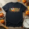 Gobble Thanksgiving Turkey Design Tee with a cute cartoon turkey face and decorative letters spelling "GOBBLE"
