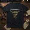Black t-shirt with white and gold text "god forbid im a im a sensitive gangster" and a golden rose graphic