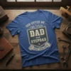Blue t-shirt with text "God Gifted Me Two Titles Dad and Stepdad & I Rock Them Both" in a shield