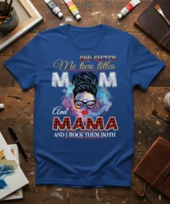 God Gifted Me Two Titles Mom And Mama And I Rock Them Both text on a blue t-shirt with a