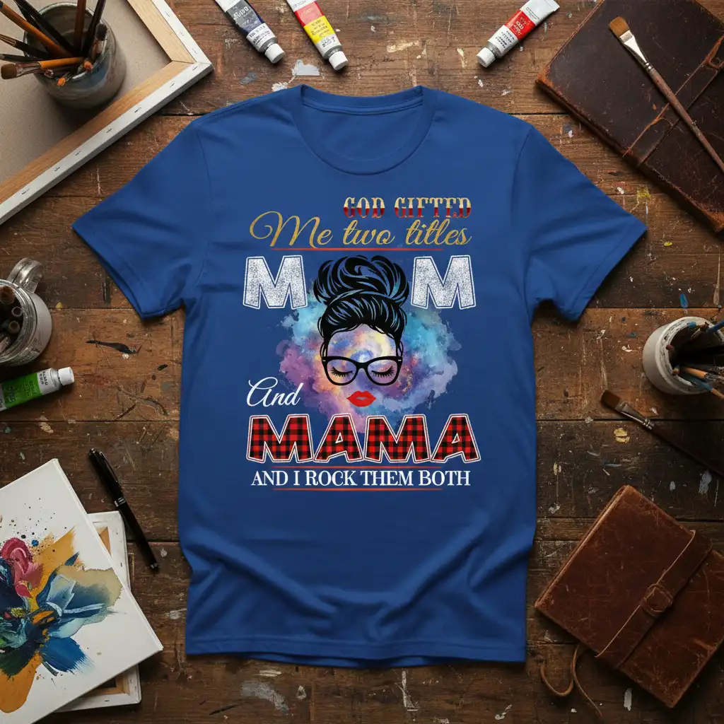 God Gifted Me Two Titles Mom And Mama And I Rock Them Both quote on blue tee with messy bun graphic