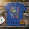 God is GOOD all THE TIME quote t-shirt with colorful lettering and a smiling sun graphic