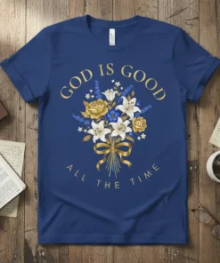 Blue t-shirt with gold text "GOD IS GOOD ALL THE TIME" and a floral bouquet design