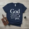 Navy blue t-shirt with white text: God is still writing your story Stop trying to steal the pen. Inspirational Christian