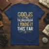 T-shirt with the quote "GOD IS THE ONLY REASON I MADE IT THIS FAR" in gold and white distressed typography