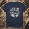 God Loves The People You Hate text within a floral heart on a navy blue t-shirt