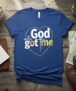 Blue t-shirt with "God No Worries Got Me" text inside a gold heart outline and cross graphic