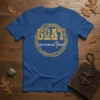Blue t-shirt with distressed gold text "GOAT" and "GOD OVER ALL THINGS" within a thorn wreath and cross graphic