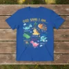 Christian t-shirt design featuring "God Says I Am" with various cute dinosaurs representing biblical affirmations like Victorious, Chosen, and Worthy