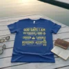 Blue t-shirt with gold text listing affirmations: God Says I Am Victorious, Kind, Chosen, Capable, Redeemed, Accepted, with scripture references