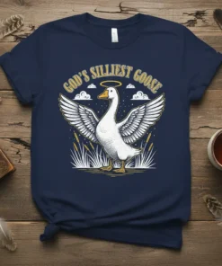 God's Silliest Goose t-shirt with a vintage illustration of a goose wearing a halo and wings, surrounded by clouds and