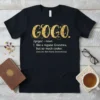 Black t-shirt with gold glitter "GOGO" text, followed by definition "like a regular Grandma, but so much cooler" and "Best