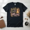Golden Retriever Mom text design featuring a cute Golden Retriever dog illustration and floral accents, on a dark t-shirt