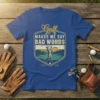 Golf Makes Me Say Bad Words quote on a blue t-shirt featuring a golfer swinging at sunset graphic