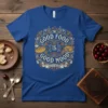 Good Food Is Good Mood text design with bread and roasted chicken graphics on a blue t-shirt