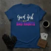 Good Girl WHIT BAD HABITS text design in white and gradient pink/purple on a navy t-shirt