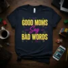 GOOD MOMS Say BAD WORDS text design on a dark t-shirt with neon yellow and pink lettering