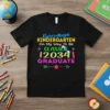 Goodbye Kindergarten On My Way To Be CLASS OF 2034 GRADUATE text with colorful graphics on a black t-shirt