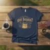 Navy t-shirt with "got beans?" text and a graphic of a burlap sack filled with coffee beans, surrounded by scattered
