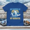 Got Passed By My Daughter skiing quote on a blue t-shirt, featuring two skiers and a sunset graphic