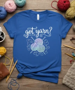 Blue t-shirt with "got yarn?" text and graphic of yarn balls and knitting needles