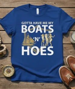 Gotta Have Me My Boats 'N' Hoes text with sailboat and women graphic on a blue t-shirt