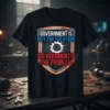 Black t-shirt with "Government Is Not The Solution Go Verment Is The Problem" quote and a gear graphic