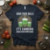 Graphic t-shirt design with text "GRAB YOUR BALLS IT'S CANNING SEASON!" and illustration of Ball jars filled with green liquid