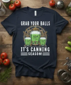 Graphic t-shirt design with text "GRAB YOUR BALLS IT'S CANNING SEASON!" and illustration of Ball jars filled with green liquid