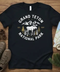 Black t-shirt with distressed graphic of a moose, mountains, and trees for Grand Teton National Park, est. 1929