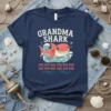 Grandma Shark doo doo doo t-shirt with cute cartoon shark illustration and wave graphics