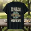 Grandma and Grandson Partners in Crime For*Life text with fist-bump graphic on a black t-shirt