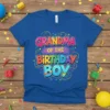 Grandma Of The Birthday Boy text in colorful, playful lettering on a blue t-shirt, celebrating a birthday boy