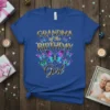 Grandma of the Birthday Girl text with colorful butterfly graphic on a royal blue t-shirt