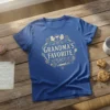 Grandma's Favorite t-shirt design with baking icons like rolling pins and cookies. Features text "GRANDMA'S FAVORITE" in a decorative circle