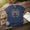 Grandma's Favorite text design with a red heart and laurel wreath on a navy t-shirt