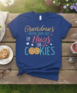 Grandmas NEVER RUN OUT OF Hugs OR COOKIES text design on a navy blue t-shirt, featuring colorful typography and cookie