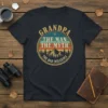 Grandpa The Man The Myth The Bad Influence text with mountain graphic on a navy t-shirt