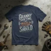 Granny Shifting Not Double Clutching Like You Should text design on a navy t-shirt, featuring pistons and vintage typography