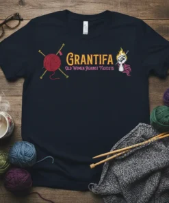 Grantifa Old Women Against Fascists T-Shirt featuring knitting needles, yarn, and a raised fist graphic. Political statement tee