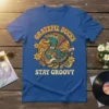 Grateful Ducks Stay Groovy retro t-shirt design with a duck playing guitar and peace sign
