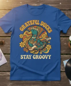 Grateful Ducks Stay Groovy retro t-shirt design with a duck playing guitar and peace sign