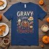 Gravy Gravy Thankful Thanksgiving t-shirt design with a cartoon turkey, pie, coffee, and football