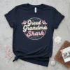 Great Grandma Shark text design on a navy t-shirt with cartoon shark graphics and bubbles