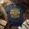 Navy blue t-shirt with yellow distressed text that reads "GREATEST DAD EVER EVER END OF DISCUSSION" in a vintage style